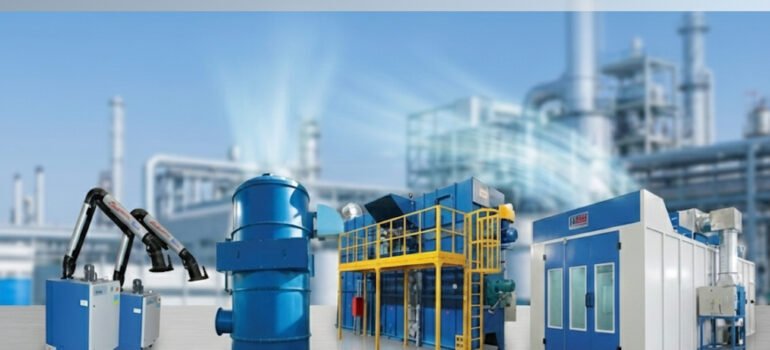 Industrial air pollution control system capturing dust, fumes, and emissions inside a manufacturing facility